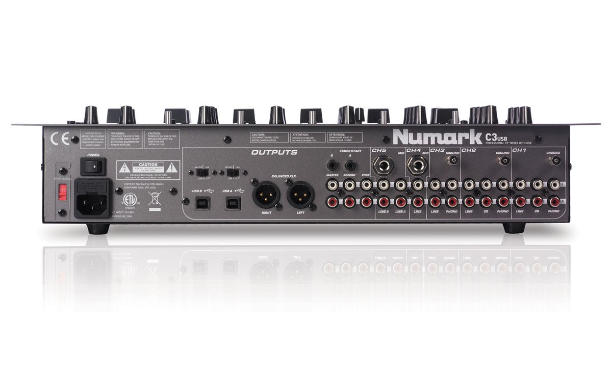 Rear panel of Numark CM200 with balanced XLR outputs, RCA inputs, and rack-mount ears attached.