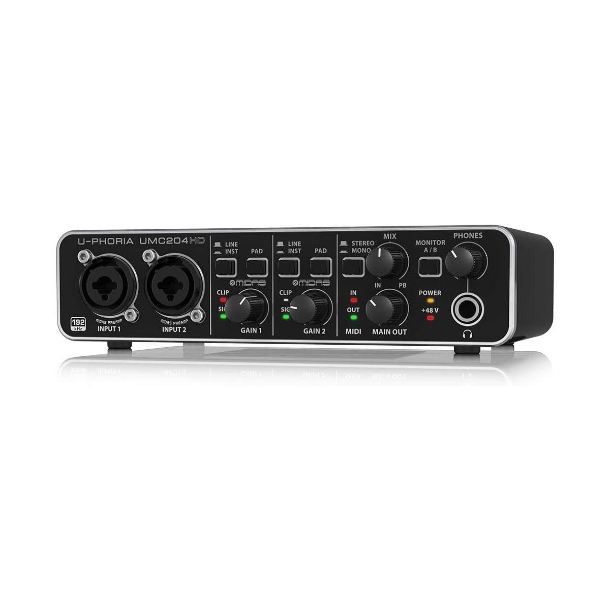 Behringer UMC204HD Kenya — angled front-left view on reflective surface showing full front panel and unit depth