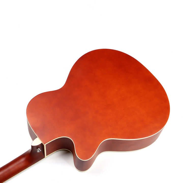 Full size acoustic guitar Kenya beginners mahogany back lower bout close-up showing gloss finish wood grain and strap button