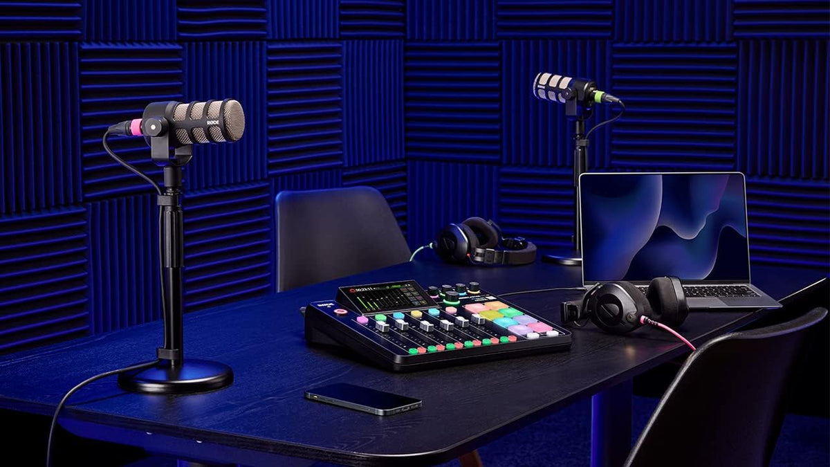 RØDECaster Pro II Kenya on a studio desk with RODE mics, headphones, laptop and acoustic foam panels`