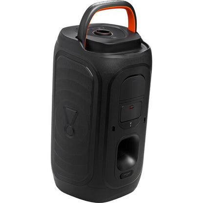 JBL PartyBox 130 Kenya three-quarter rear view showing orange carry handle, bass port and side control buttons
