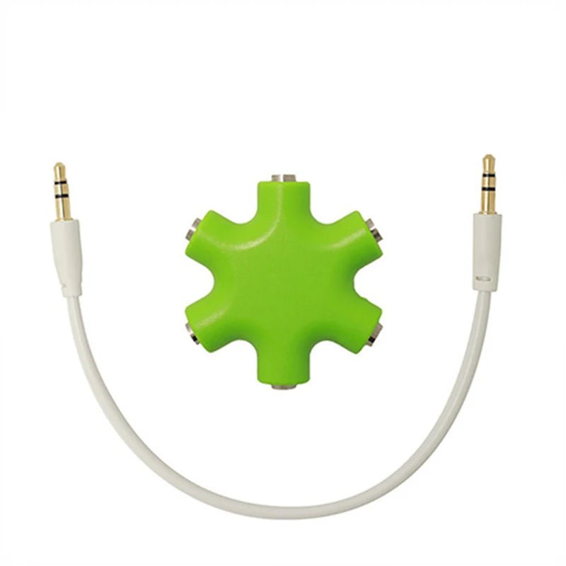 Green 3.5mm audio splitter Kenya star hub with white cable and two gold-tipped male jacks, white background
