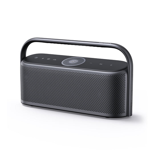 oundcore Motion X600 portable Bluetooth speaker displaying its sleek design and multi-driver layout, set on a modern table.