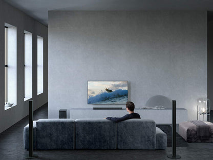 ony HT-S700RF 5.1 Home Cinema Soundbar System featuring the front soundbar, wireless subwoofer, and tall boy rear speakers in a modern living room setup.

