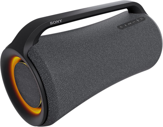 Sony SRS-XG500 portable Bluetooth party speaker with built-in handle and LED ring lighting, set up in an outdoor environment.