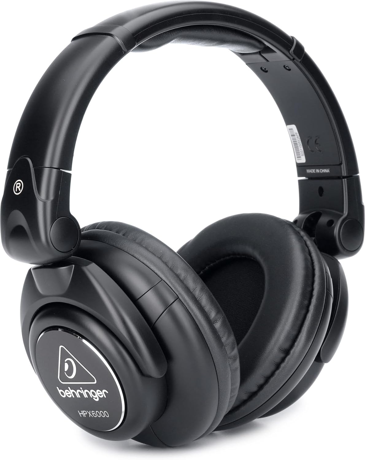 Behringer HPX6000 professional DJ headphones showing over-ear cups and adjustable headband against a white background.