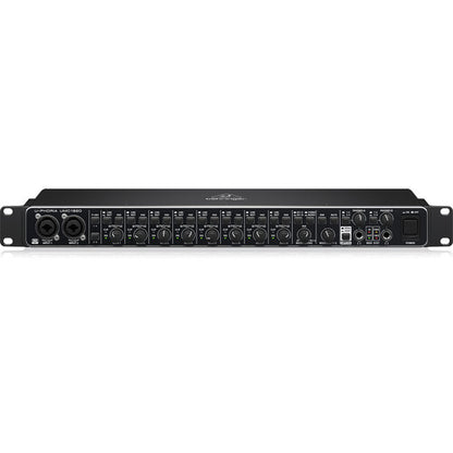 Front view of Behringer UMC1820 showing eight combo XLR/TRS inputs, gain knobs, LED indicators, and MIDI ports