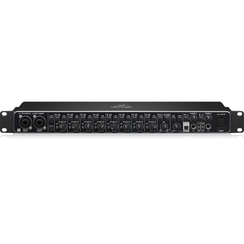 Front view of Behringer UMC1820 showing eight combo XLR/TRS inputs, gain knobs, LED indicators, and MIDI ports