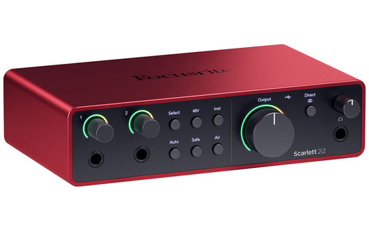 Scarlett Solo 4th Gen USB audio interface on a desk with clearly visible controls and indicator lights.