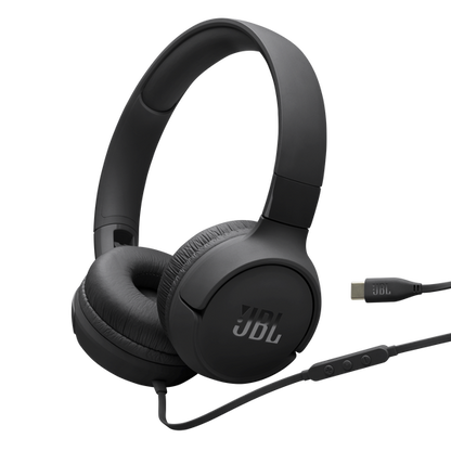 JBL Tune 520C USB-C on-ear headphones folded flat on a white surface, showing padded ear cushions and tangle-free cable.