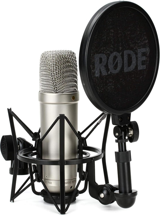 RØDE NT1-A microphone mounted in SM6 shock mount with pop filter in front, on a studio desk.”