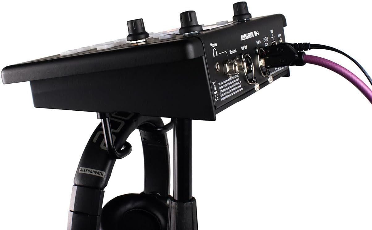 Allen Heath ME-1 Kenya rear panel on stand with purple cable connected to Link In and headphones hanging below