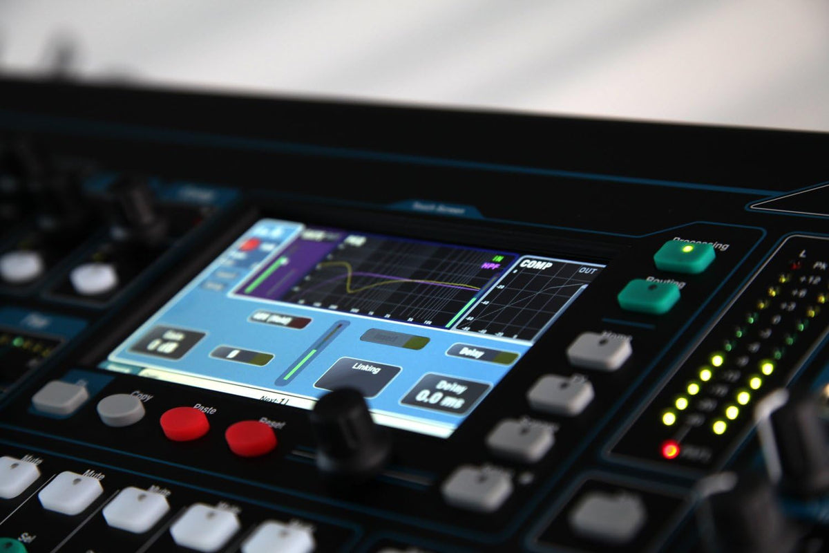 Allen Heath Qu-24 Kenya close-up of CH22-24 faders and blue-illuminated mix select buttons on right panel`