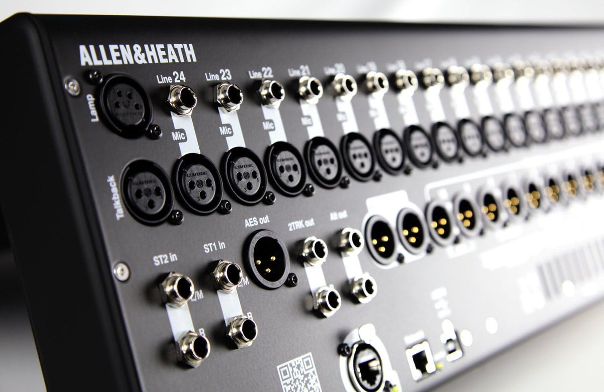 Allen Heath Qu-24 Kenya close-up of CH22-24 faders and blue-illuminated mix select buttons on right panel`