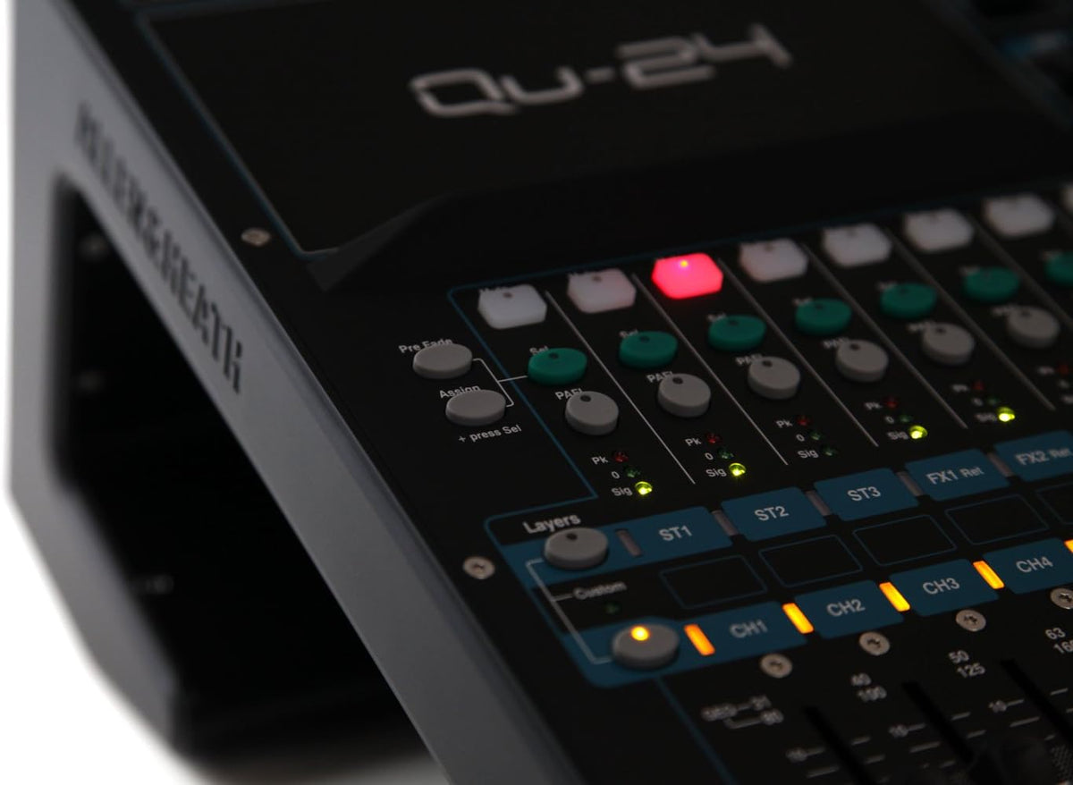 Allen Heath Qu-24 Kenya close-up of layer select buttons and illuminated amber faders with channel strip labels