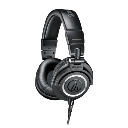 Audio-Technica ATH-M50x Kenya black closed-back monitor headphones 3/4 angle view showing earcup logo and padded headband