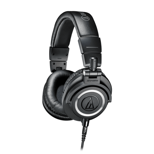 Audio-Technica ATH-M50x Kenya black closed-back monitor headphones 3/4 angle view showing earcup logo and padded headband
