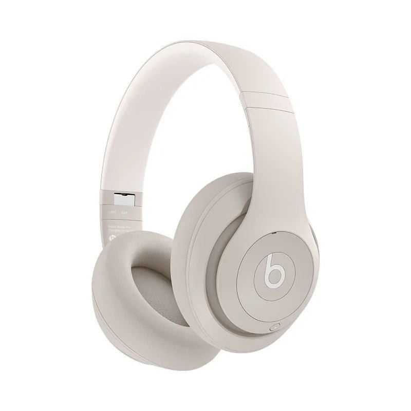 Beats Studio Pro Kenya over-ear wireless headphones in sand beige colorway, front 3/4 view on white background