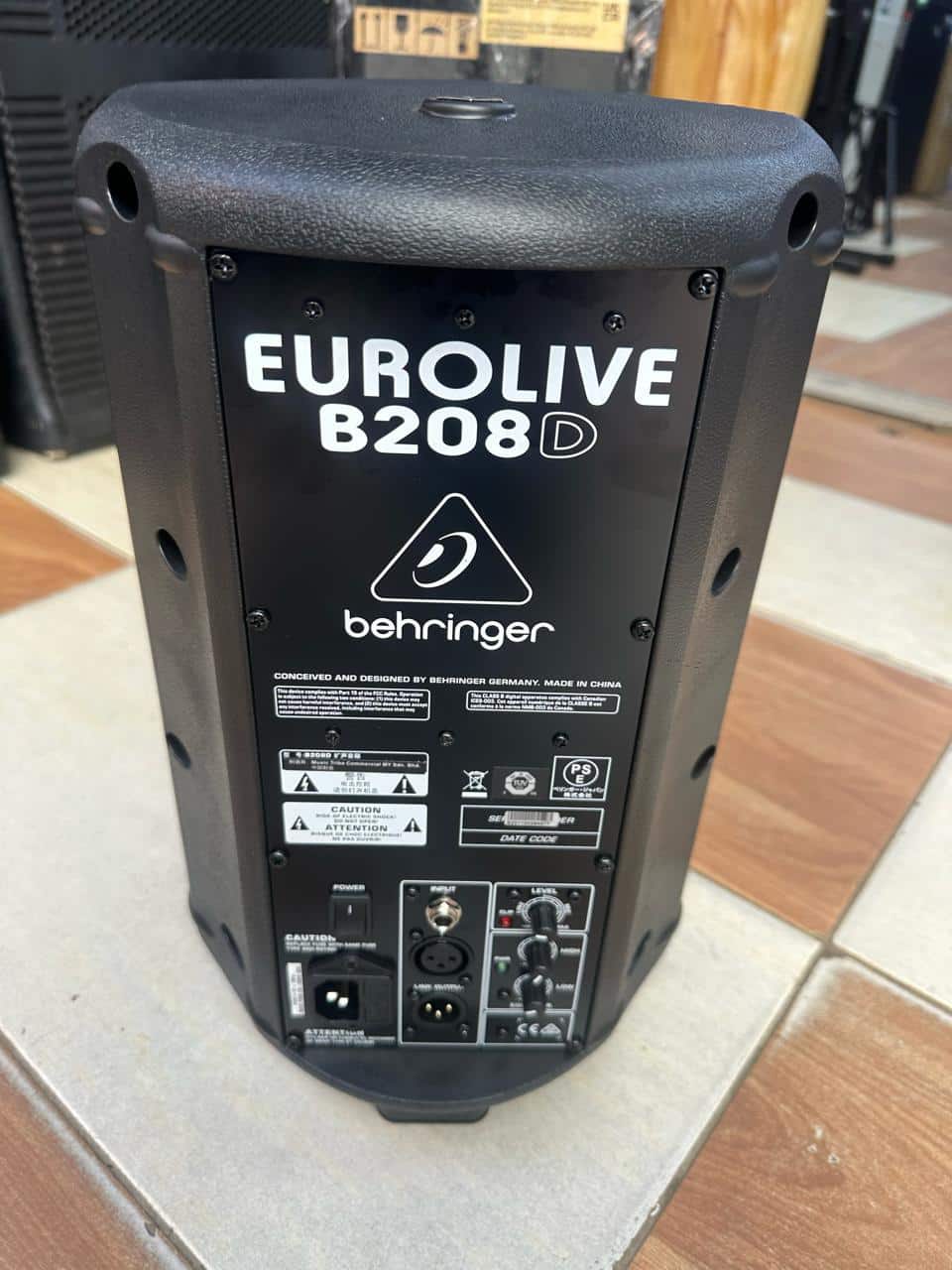 Behringer B208D Kenya rear panel showing XLR input, TRS input, level knob, power socket and Eurolive branding
