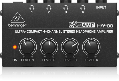 Behringer HA400 headphone amplifier Kenya — angled top view showing 4 volume knobs and headphone jacks on metal chassis