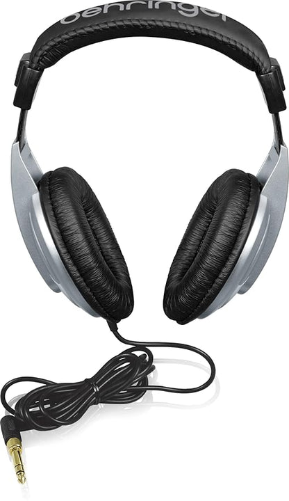Behringer HPM1000 Kenya closed-back studio headphones front view with coiled cable and gold 6.35mm jack