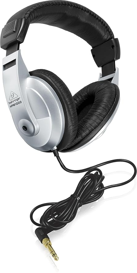 Behringer HPM1000 Kenya three-quarter view showing HPM1000 model label on silver ear cup with full cable length
