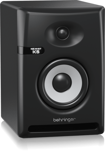 Behringer NEKKST K5 Kenya powered studio monitor 3/4 front-left angle showing cabinet depth and front bass port