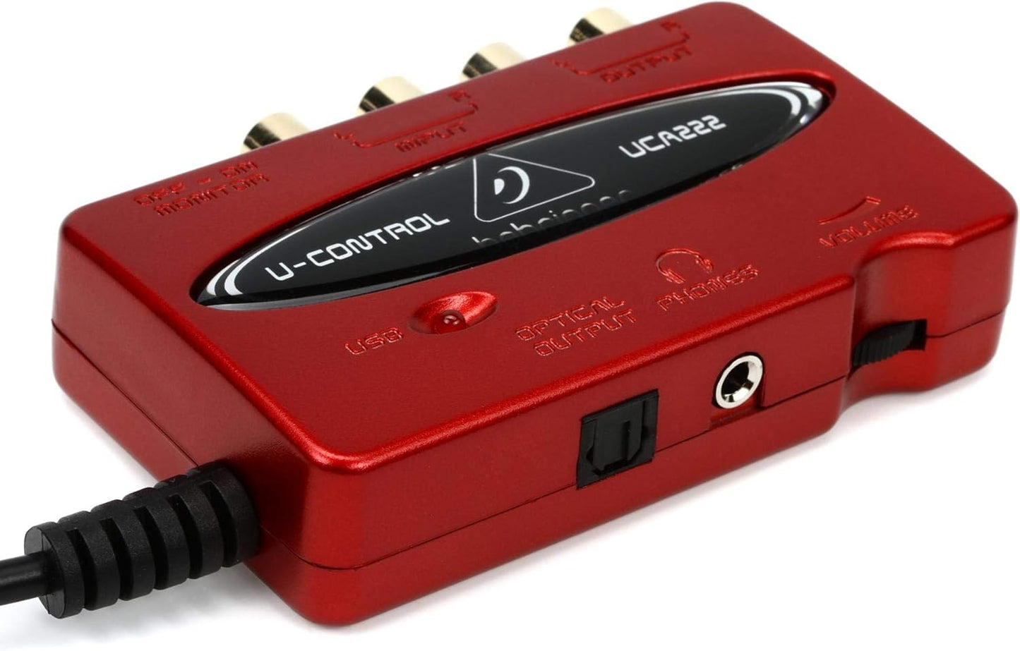 Behringer UCA222 Kenya red USB audio interface angled view showing USB port, optical output and headphone jack