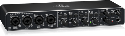 Behringer UMC404HD Kenya — left-angle view showing 4 XLR/TRS combo inputs and gain knobs on front panel