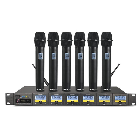 BNK X85 6 in 1 wireless microphone system Kenya — six UHF handhelds standing upright in front of rack receiver