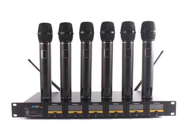 BNK X85 6 in 1 wireless microphone system Kenya — angled front view of all six mics alongside the UHF receiver unit