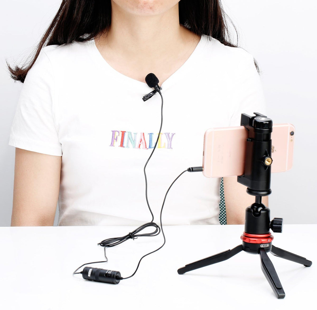 BOYA BY-M1 lavalier microphone clipped to shirt collar during interview