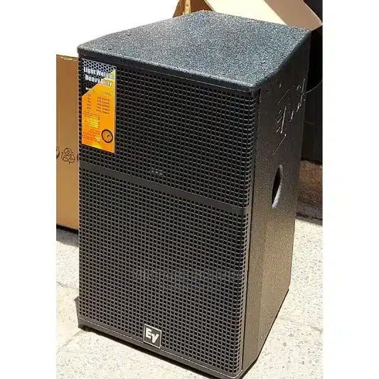 Black speaker with a brand label on a white background