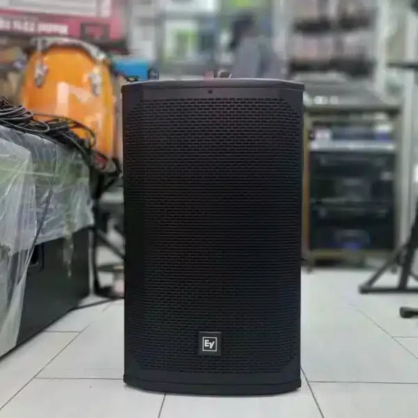 EV EKR115 passive speaker Kenya front view in-store setting showing full grille, EV badge and carry handle on top