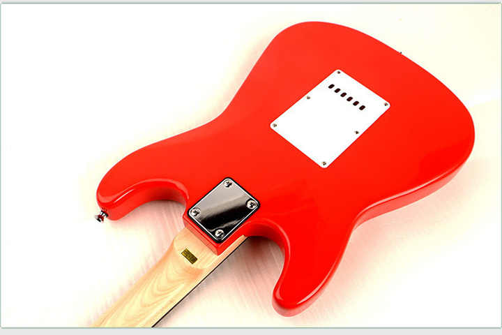Fender passive lead guitar Kenya red body rear view showing contoured back, tremolo cavity cover and maple neck heel