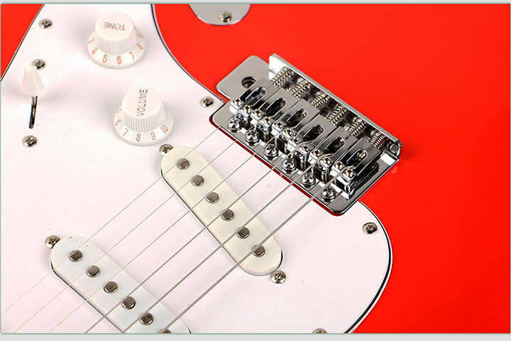 Fender passive lead guitar Kenya red body showing three single-coil pickups, chrome synchronized tremolo bridge and strings