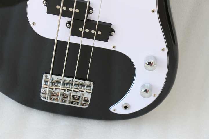 Fender Precision Bass Kenya black body closeup showing split single-coil pickup, chrome bridge and control knobs