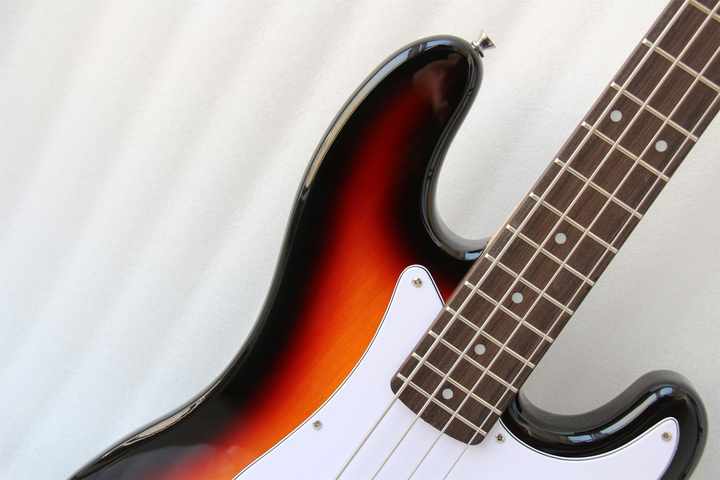 Fender Precision Bass Kenya sunburst upper body contour and rosewood fingerboard neck join detail