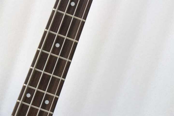 Fender Precision Bass Kenya rosewood fingerboard closeup showing frets and dot inlays