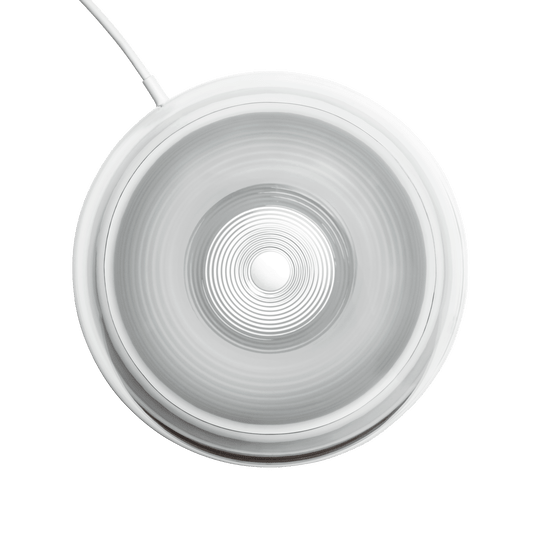 Harman Kardon SoundSticks 4 Kenya subwoofer top-down view — transparent dome showing concentric driver detail and cable