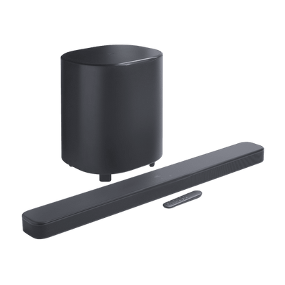 Soundbar + subwoofer at an angle with remote control visible