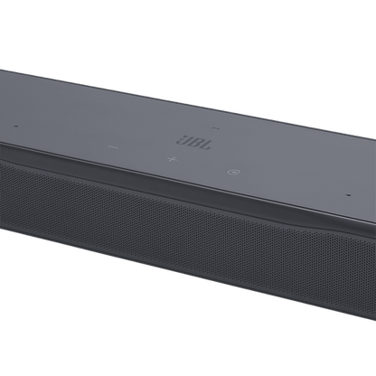 Close-up top-down angle of soundbar showing JBL logo and touch controls on top panel