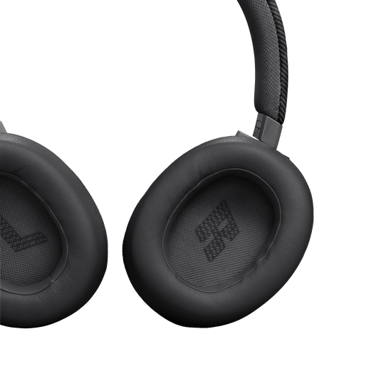 JBL Live 770NC Kenya close-up of cushioned earcups showing soft padding and embossed Bluetooth icon