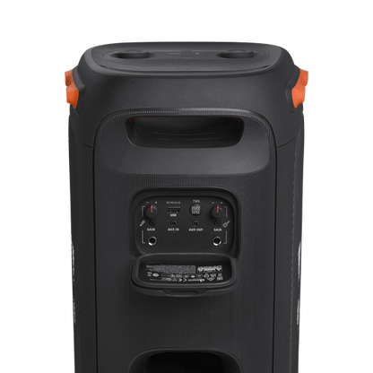 JBL PartyBox 110 Kenya — rear panel open showing guitar, mic, aux and USB input ports, orange carry handles