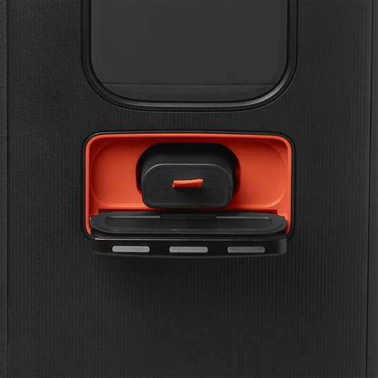 JBL PartyBox Club 120 Kenya replaceable battery compartment open showing orange release latch