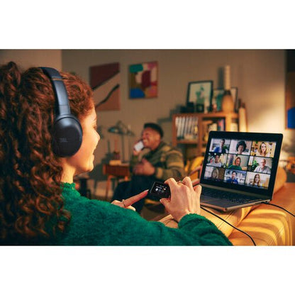 JBL Tour One M3 Smart TX Kenya headphones worn during a laptop video call at home