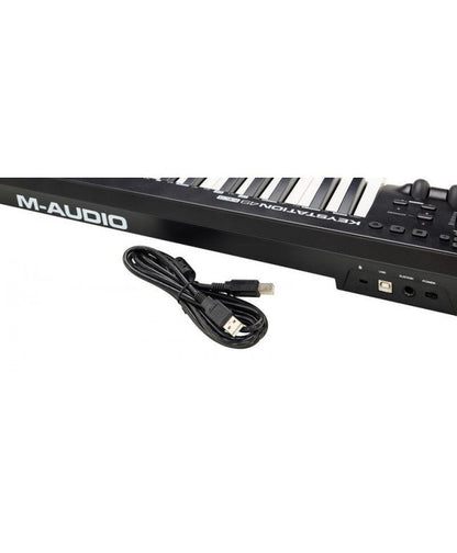 M-Audio  Keystation 49 MK3 Kenya — rear three-quarter view with included USB cable laid out beside unit