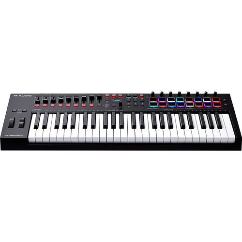 M-Audio Oxygen Pro 49 Kenya front-left angle showing full keyboard and RGB drum pad section