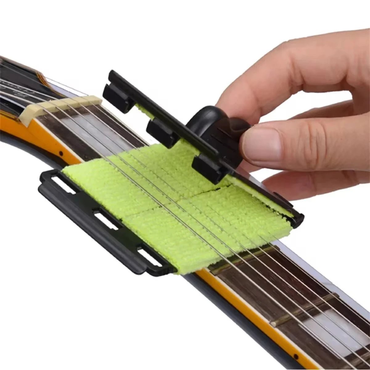 Miwayer guitar string cleaner wrapping around guitar strings to remove sweat and grime