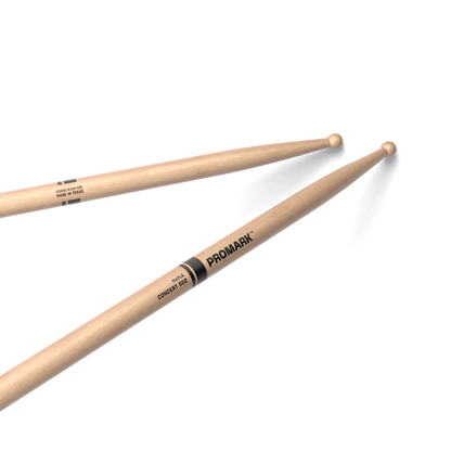 ProMark SD2W Bolero Kenya — two drumsticks crossed diagonally, wood ball tips visible, Promark Concert SD2 label shown